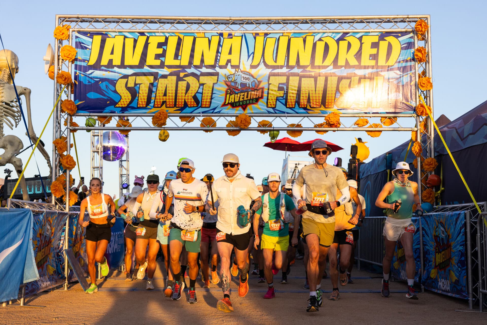 Runners leave the start arch at Javelina Jundred